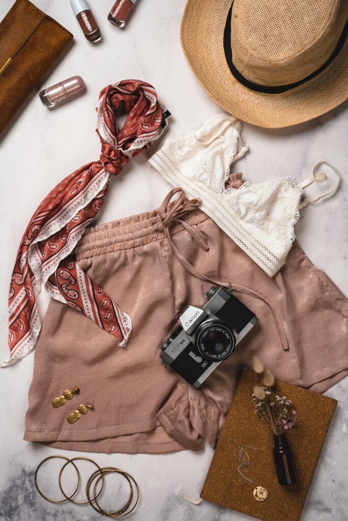 Elevate your summer style with chic accessories and outfits in this flatlay.